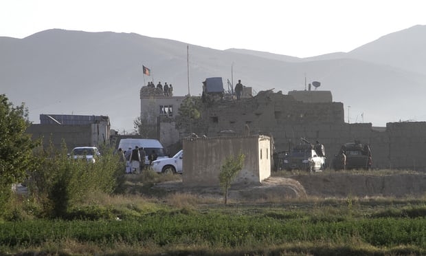 Afghan security forces stand guard on the roof of the main prison building after a Taliban attack in Ghazni. Photograph: Rahmatullah Nikzad/AP