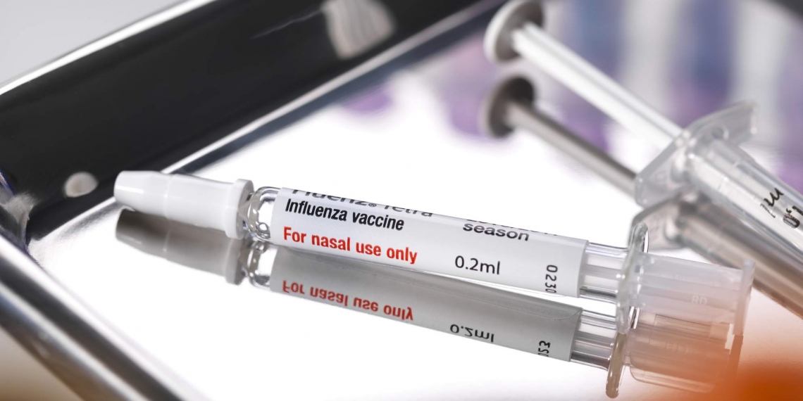 Nasal influenza vaccine on a medical tray.