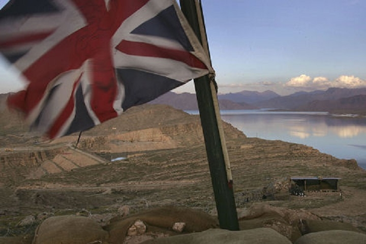 KAJAKI, AFGHANISTAN - MARCH 13:  A Union Jack flies at a Royal Marine outpost overlooking the Kajaki hydroelectric dam March 13, 2007 in Afghanistan's southern Helmand province. Some 4,500 NATO forces are battling Taliban in the area as part of Operation Achilles, the largest NATO operation yet in Afghanistan. The main objective of the offensive is to clear Taliban from the area in order to upgrade the dam, which currently provides electricity to much of southern Afghanistan. The USAID funded project would be the largest developement project in Afghanistan, providing electricy to millions more Afghans. Earlier work on the dam, which was completed by the United States in 1975, was suspended June 4, 2006 due to Taliban attacks.  (Photo by John Moore/Getty Images)