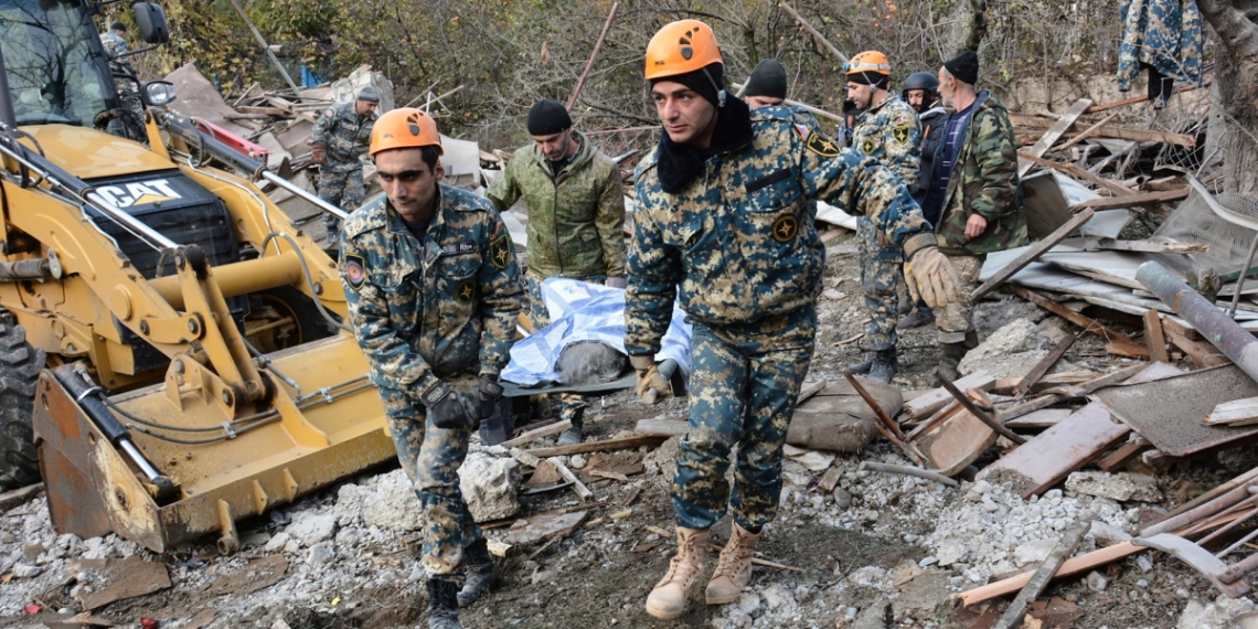 SENSITIVE MATERIAL. THIS IMAGE MAY OFFEND OR DISTURB. Rescuers carry the body of a victim following what is said to be recent shelling in the city of Stepanakert during a military conflict over the breakaway region of Nagorno-Karabakh, in this handout photo released November 6, 2020. Armenian Unified Infocentre/Handout via REUTERS  ATTENTION EDITORS - THIS IMAGE HAS BEEN SUPPLIED BY A THIRD PARTY. NO RESALES. NO ARCHIVES. MANDATORY CREDIT.